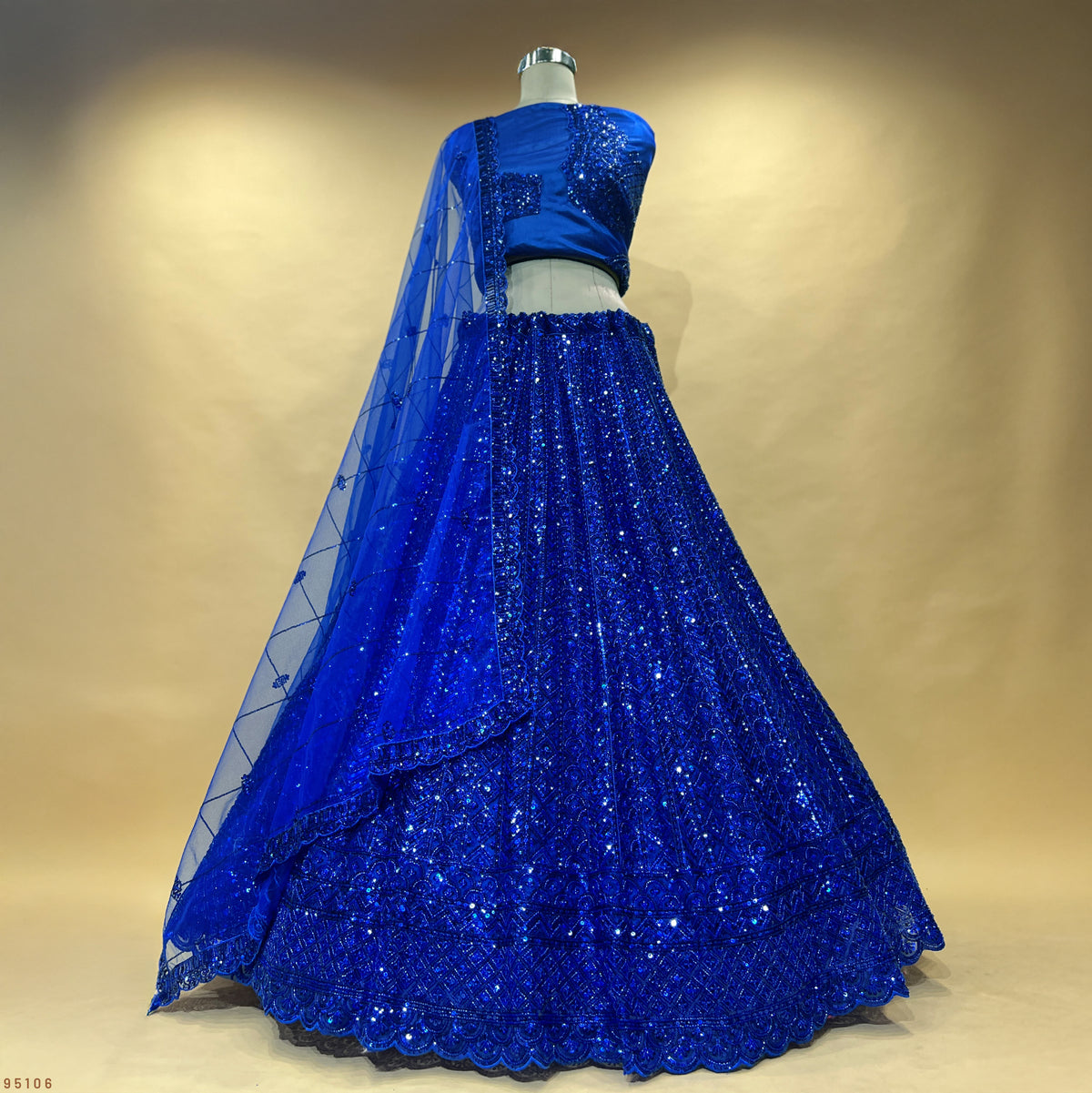 The Amber Fort Collection: Blue Net Lehenga Ensemble – Blue – view 1