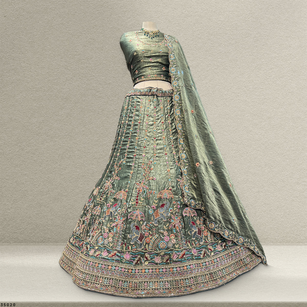 The Utsav Darbar: Green Silk Lehenga Ensemble – Green – view 1
