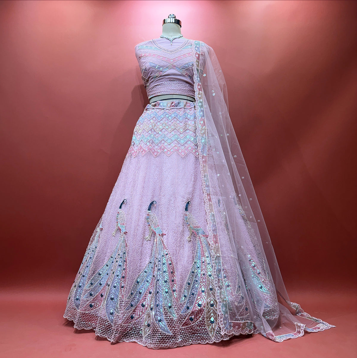 The Ananda Heirloom: Pink Net Lehenga Ensemble – Baby Pink – view 1