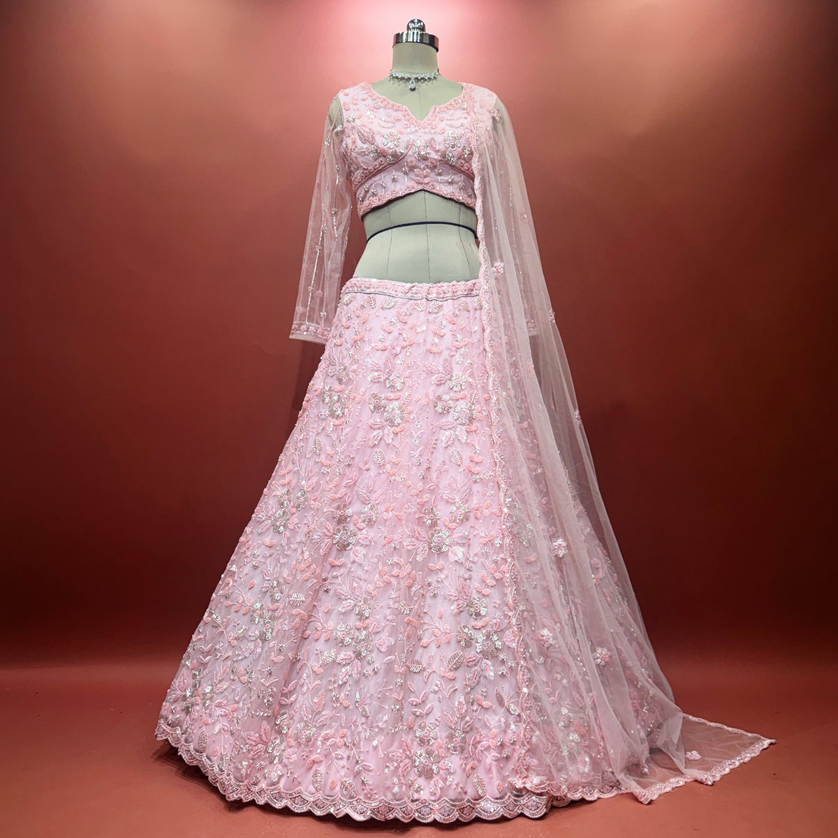 The Parampara Darbar: Pink Net Lehenga Ensemble IV – Baby Pink – view 1