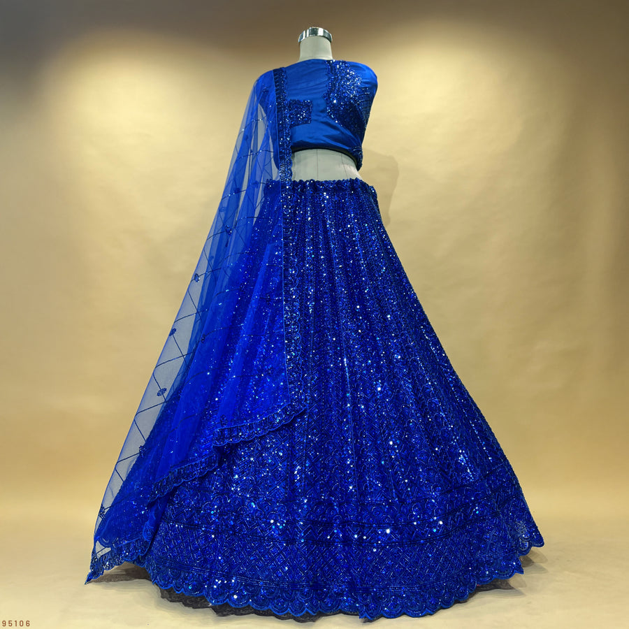 The Amber Fort Collection: Blue Net Lehenga Ensemble