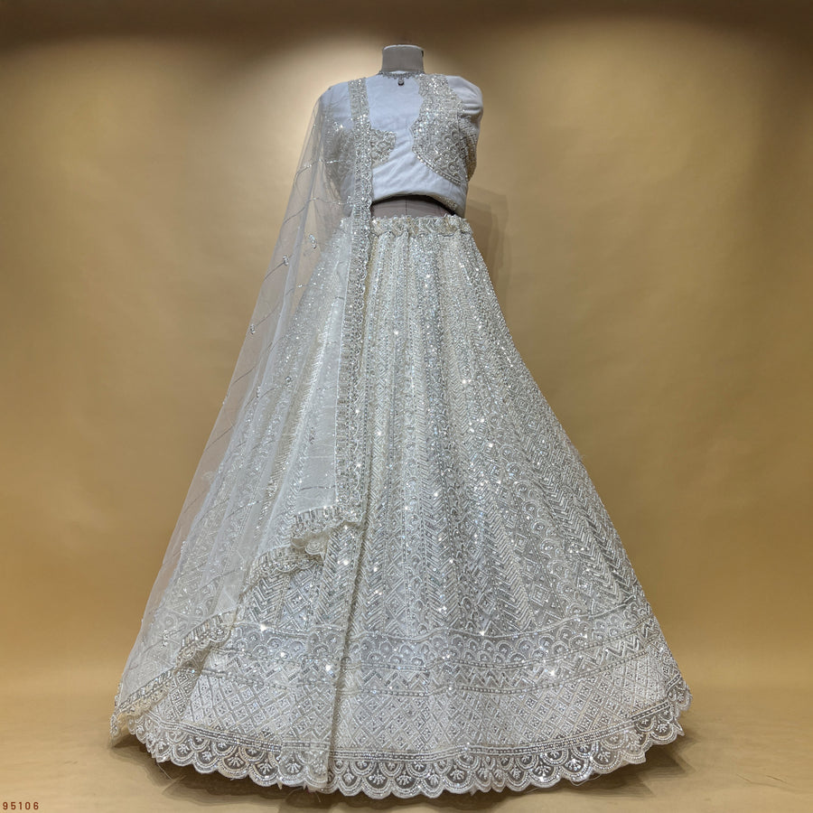 The Amber Fort Collection: Blue Net Lehenga Ensemble