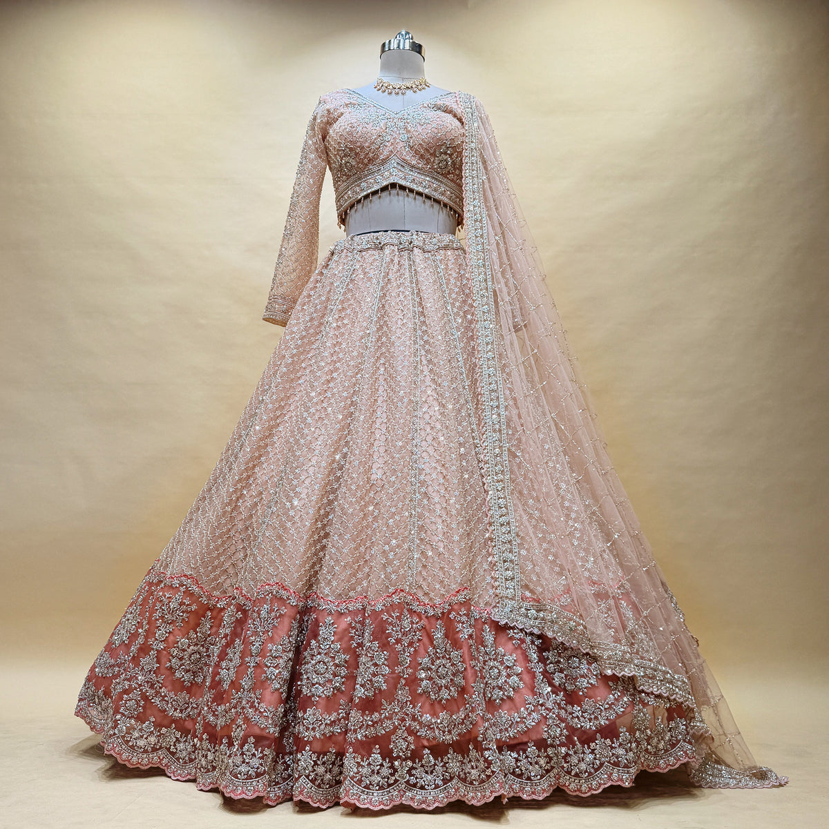 The Saubhagya Heirloom: Peach Net Lehenga Ensemble IV – Peach – view 1